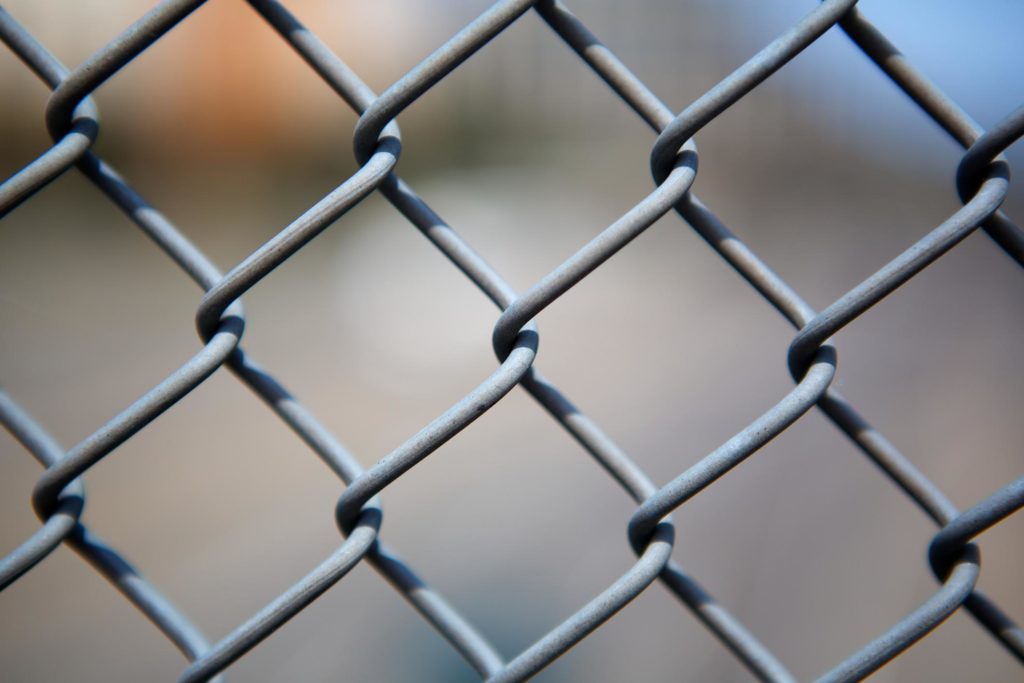 a metal chain link fence